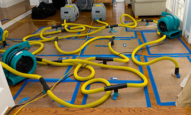 Professional Flood Damage Restoration technician working in Exeter, RI